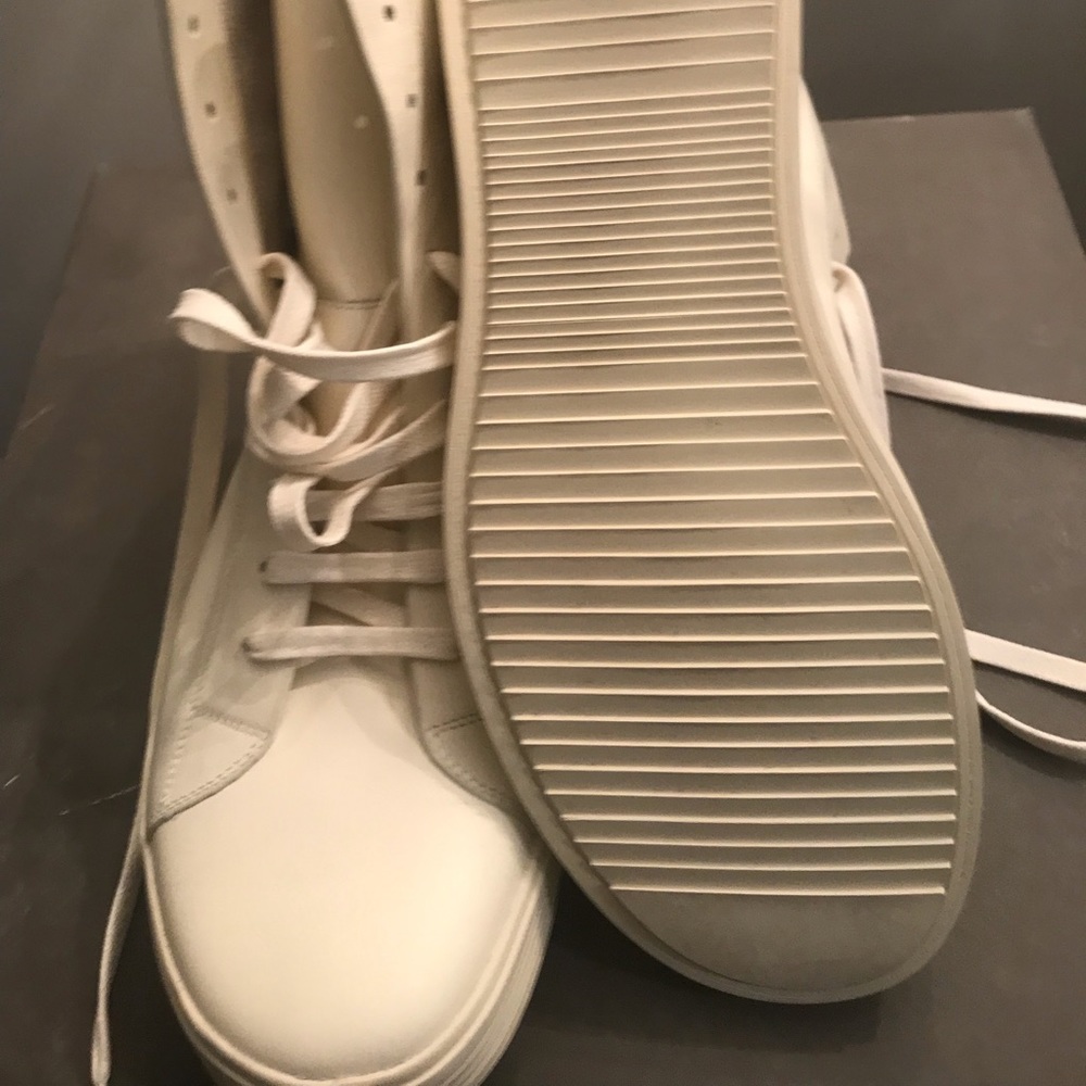 Brand new never worn white high top on sneaker. I have 2 pairs . Size 10
